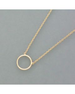 Delicate gold necklace with a circle pendant