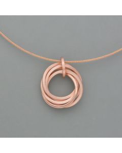 Small playful rings pendant made of rosé gold plated silver